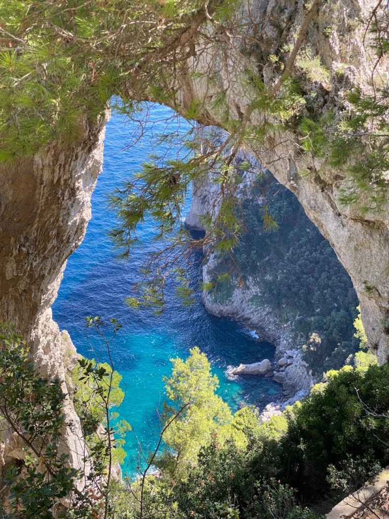 view of the sea and the natural arch on capri island