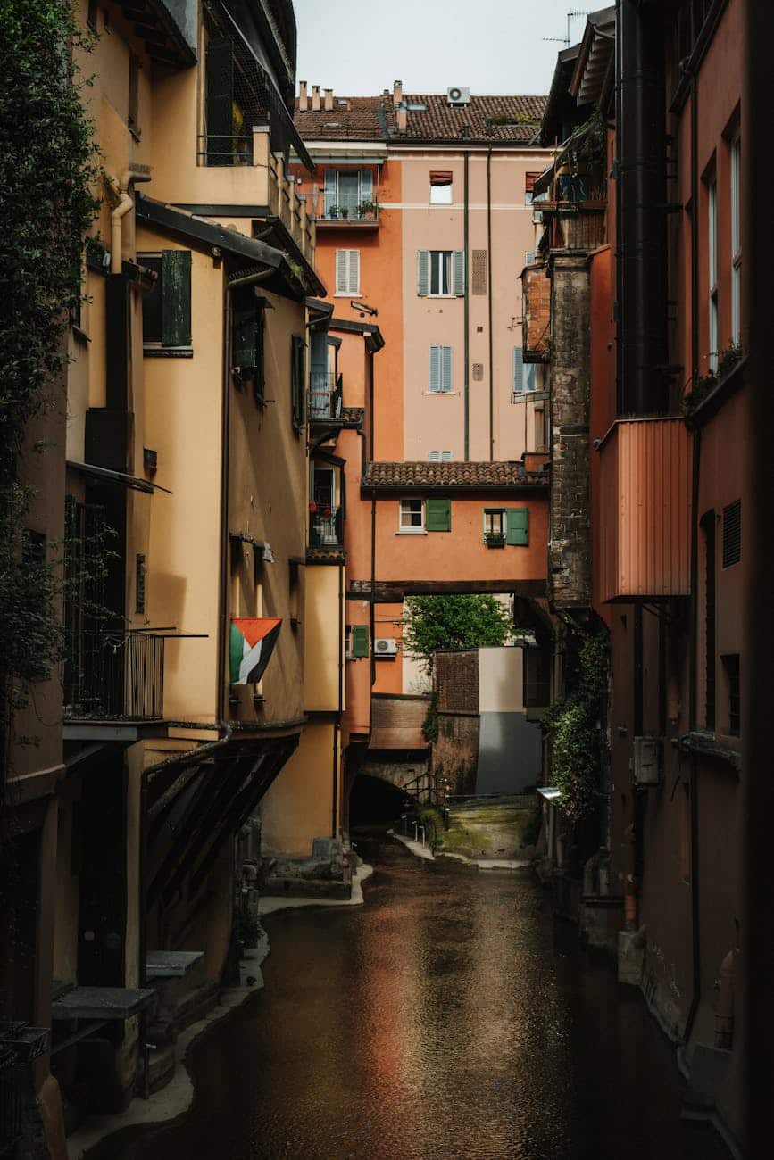 view of a canal between apartment buildings in bolonia italy