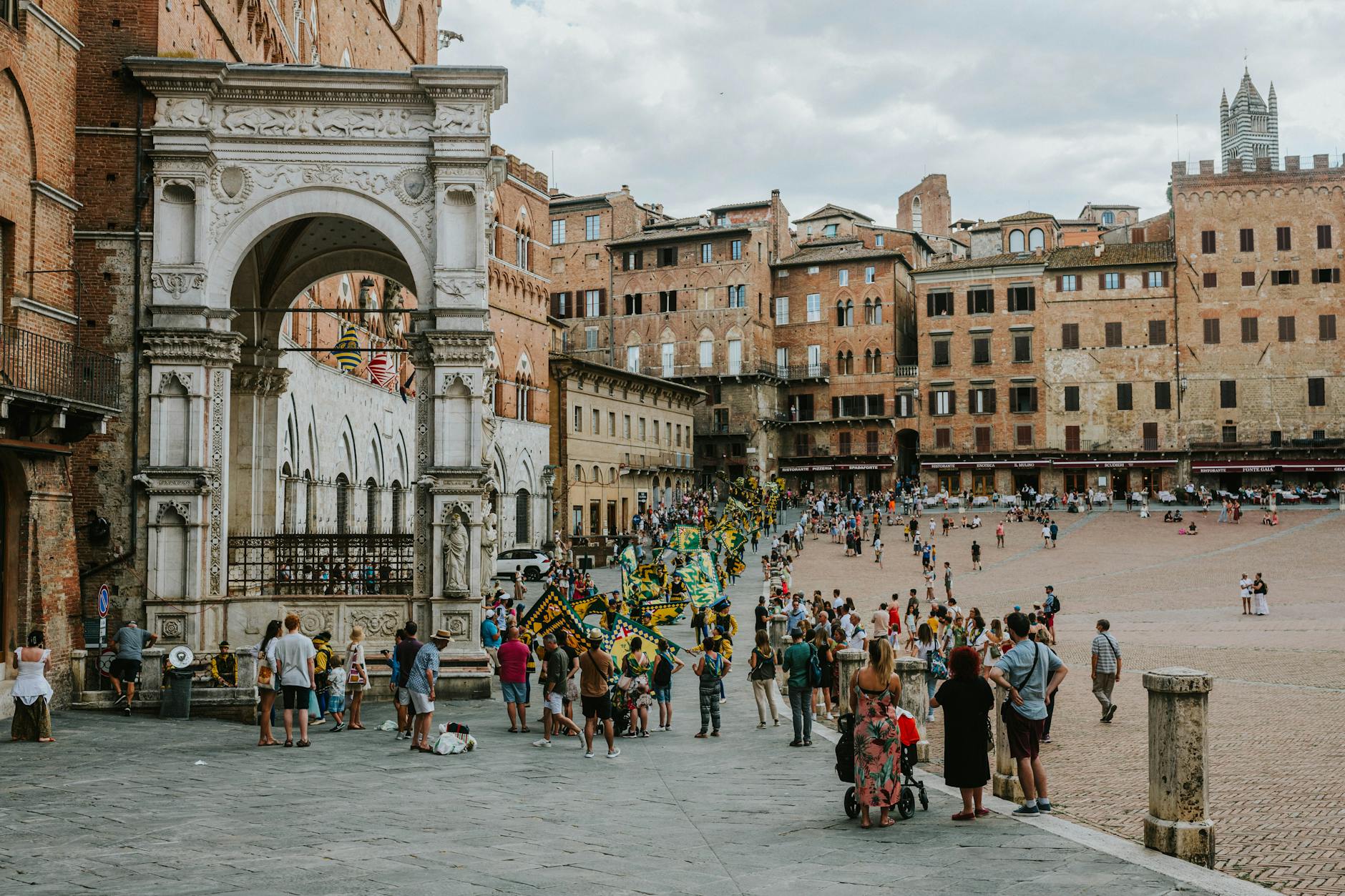 tourists on square in old town