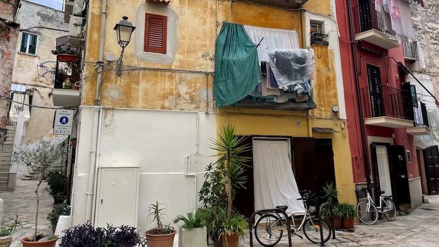 ITALY, Apulia, Bari - OCTOBER 11, 2021: Stroll through the narrow alleys of Bari Vecchia with laundry drying from balconies, pastel-coloured facades and the authentic charm of Southern Italy.