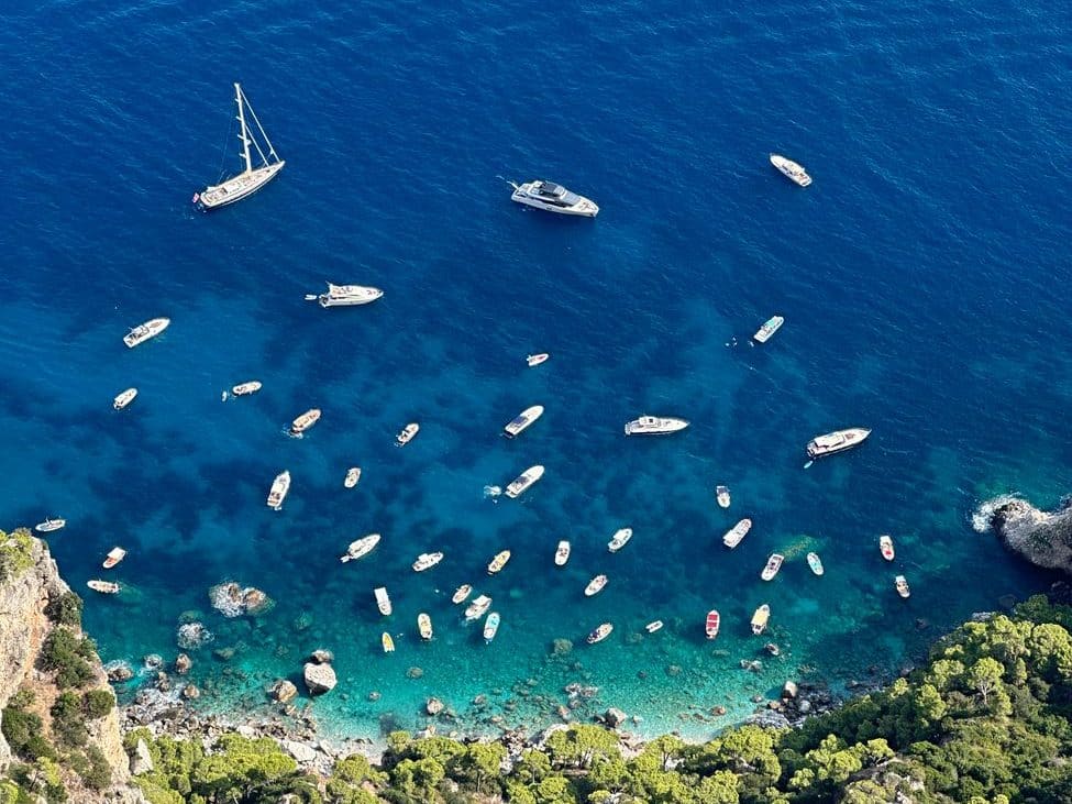 various boats on a blue shore
